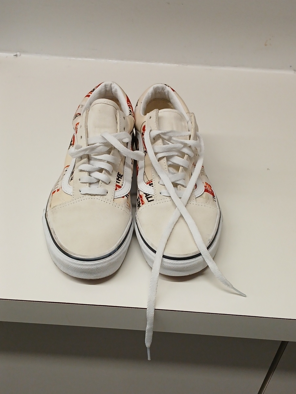 Vans White Low-Top Sneakers with Red Logo Pattern